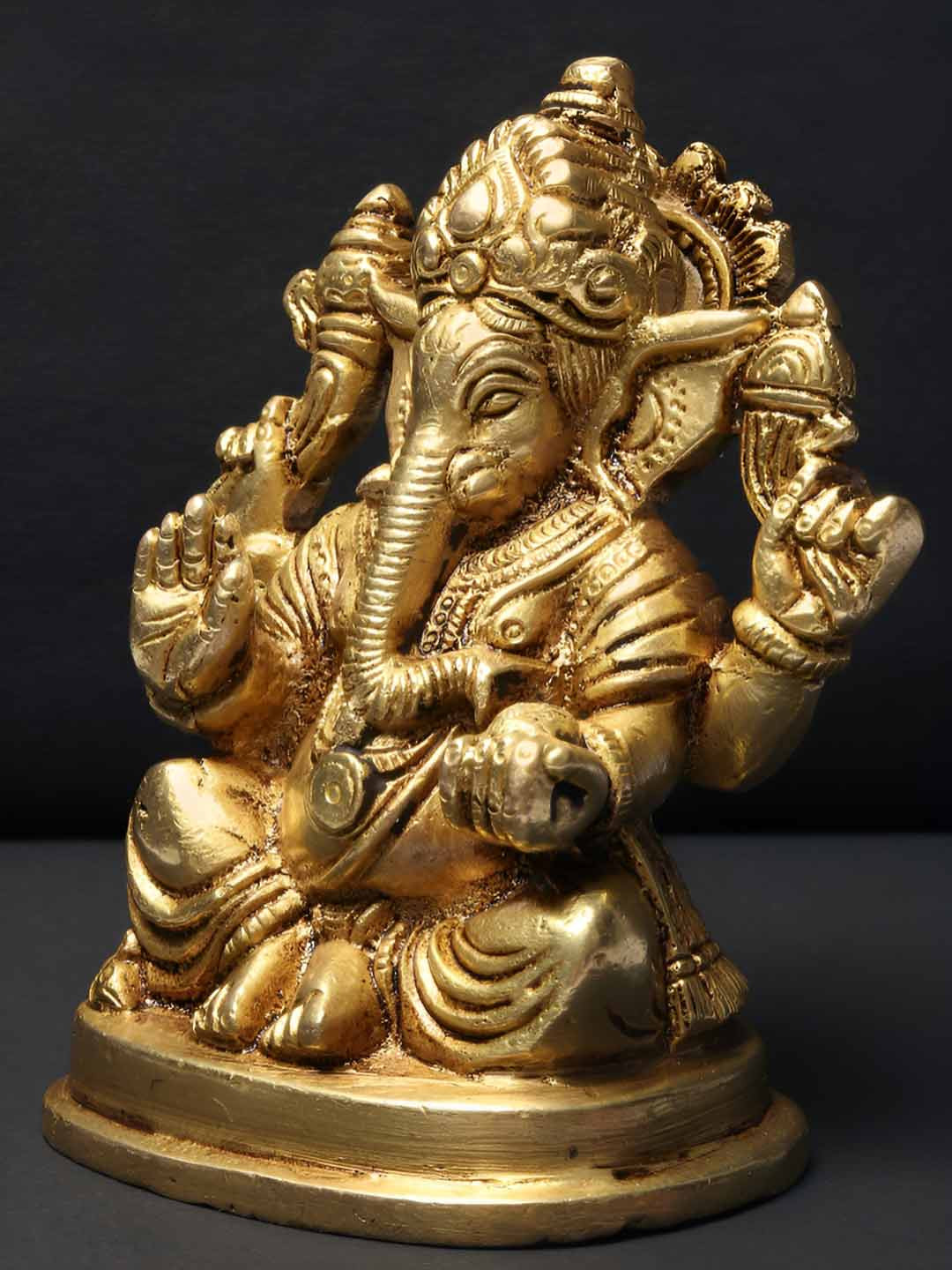 Exotic India Chaturbhuja Lord Ganapati Gold Brass Metallic Prayer Room Small Showpiece - 5 Inches