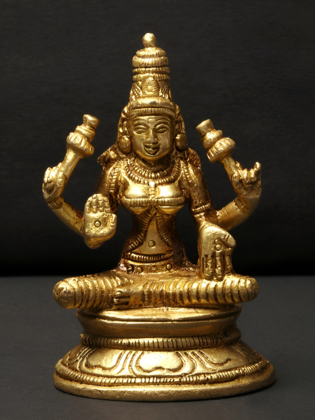 Exotic India Sitting Devi Lakshmi Gold Brass Metallic Prayer Room Medium Showpiece - 3.3 Inches