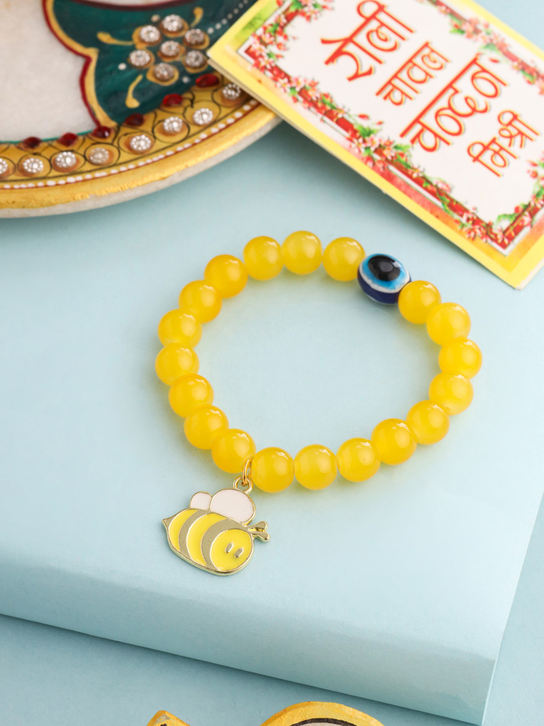 NVR Kids Cartoon Design Yellow Artificial Beads Thread Rakhi with Roli Chawal Chandan