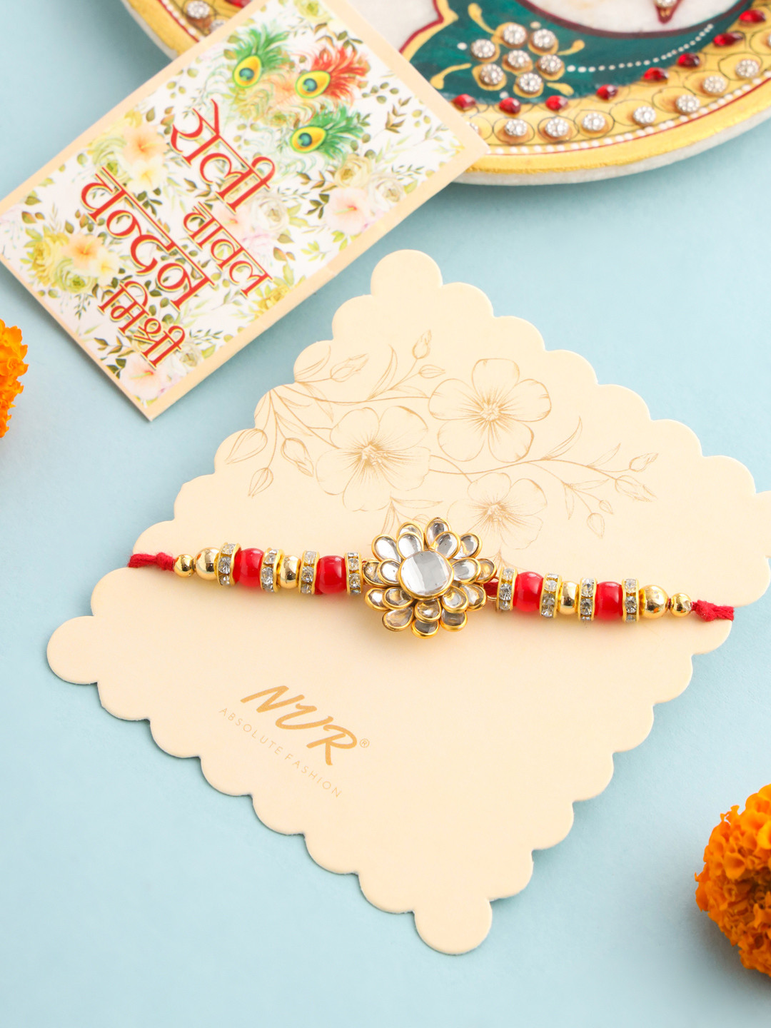 NVR Unisex Red Kundan Studded Floral  Thread Rakhi with Roli Chawal Chandan Mishri