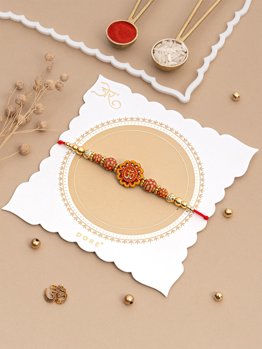 Dore Divine Om Floral Rakhi Set with Sandalwood Beads and Roli Chawal