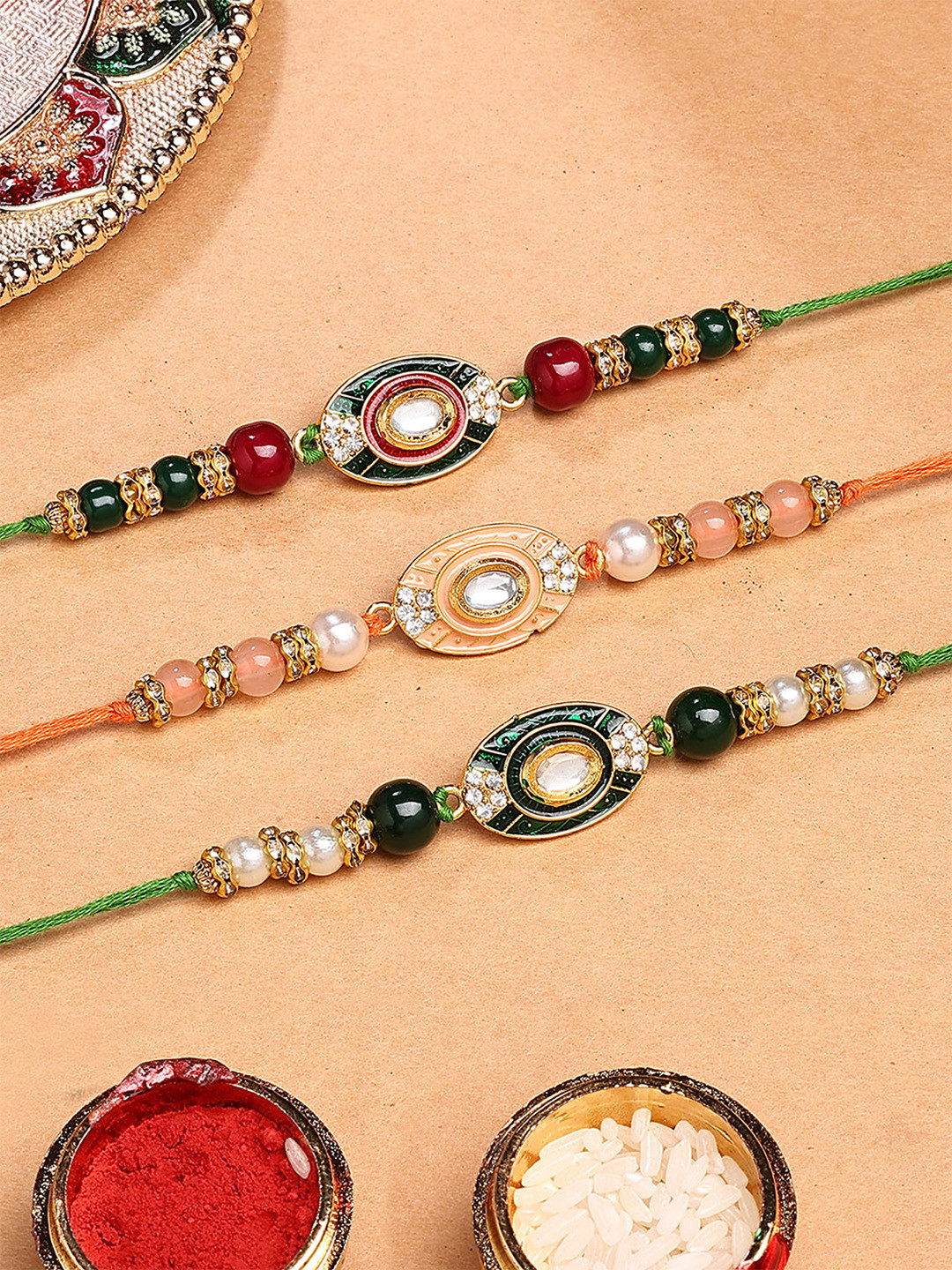 KARATCART Set of 3 Green and Pink Enamel Floral Design Rakhi with Roli & Chawal