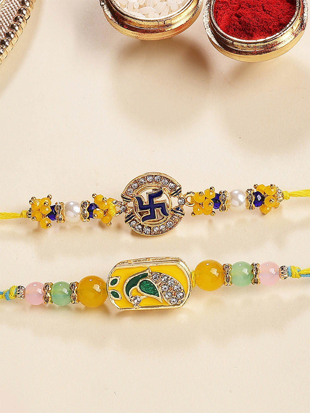 KARATCART Men Set of 2 Peacock and Swastik Design Enamel Kundan Rakhi with Roli & Chawal