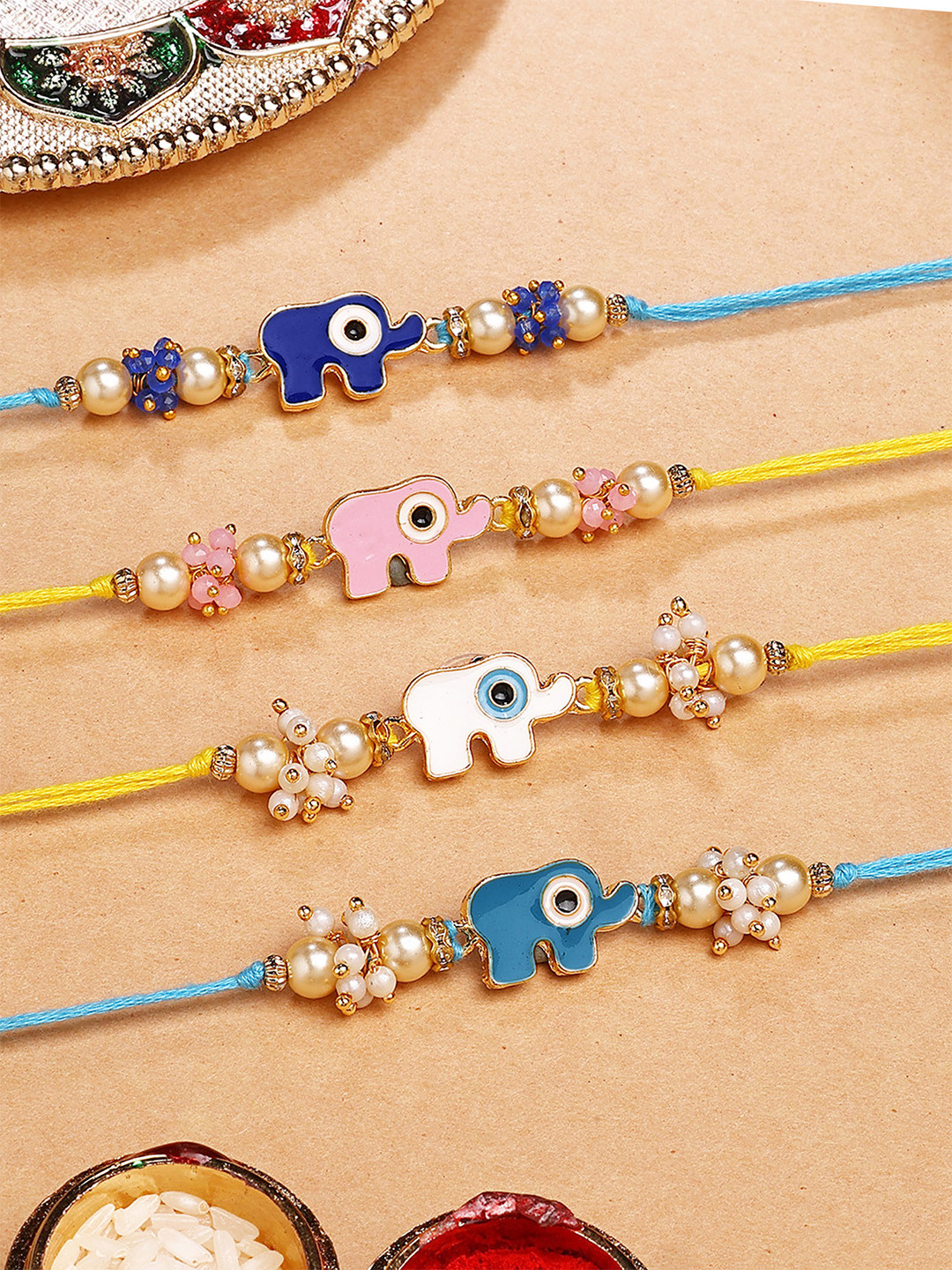 KARATCART Set Of 4 Elephant Design Kundan Thread Rakhi for Brother with Roli & Chawal
