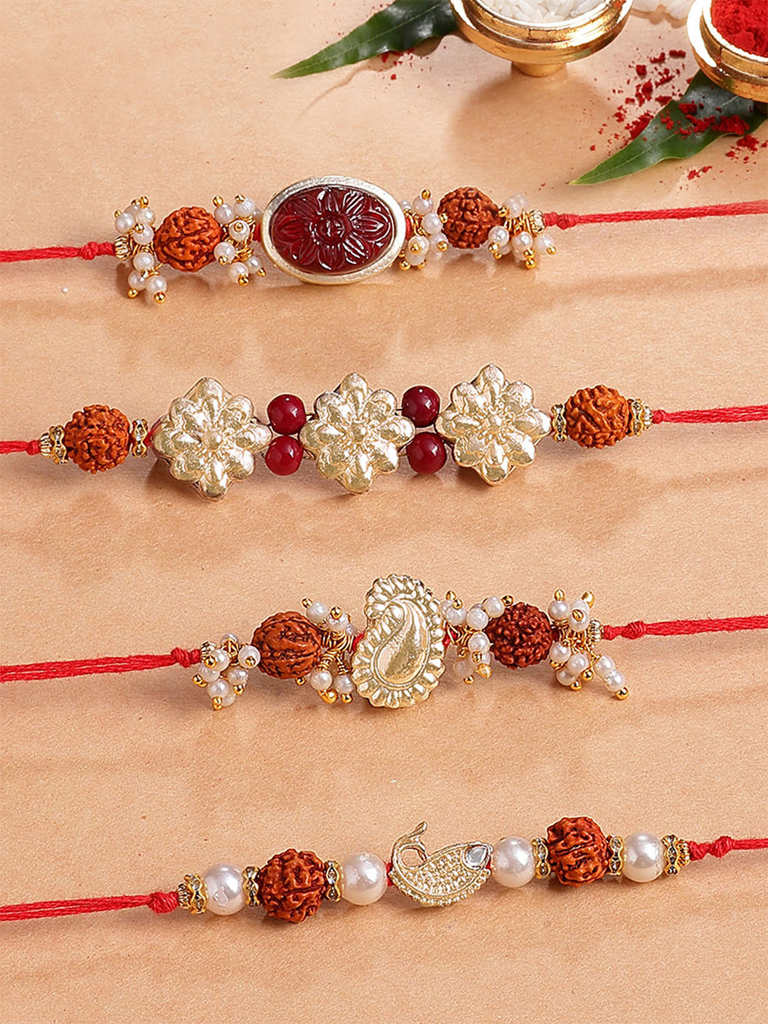 KARATCART Set Of 4 Carved Stone and Rudraksha Kundan Rakhi for Brother with Roli & Chawal