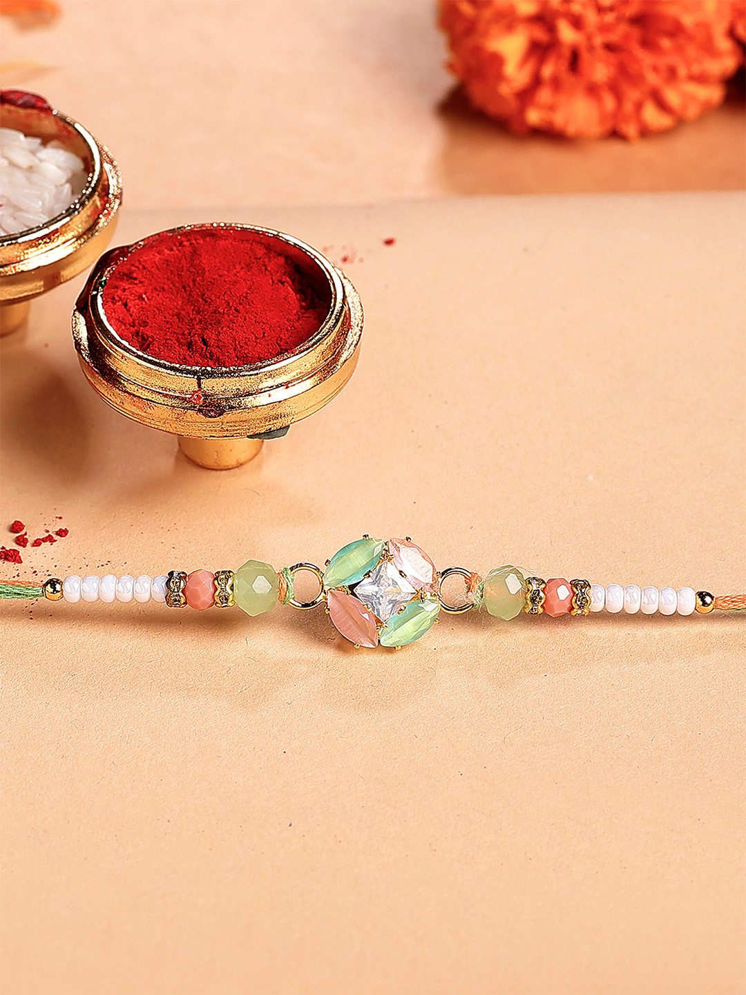 KARATCART Rhinestones Floral Bhiya Thread Rakhi with Roli & Chawal