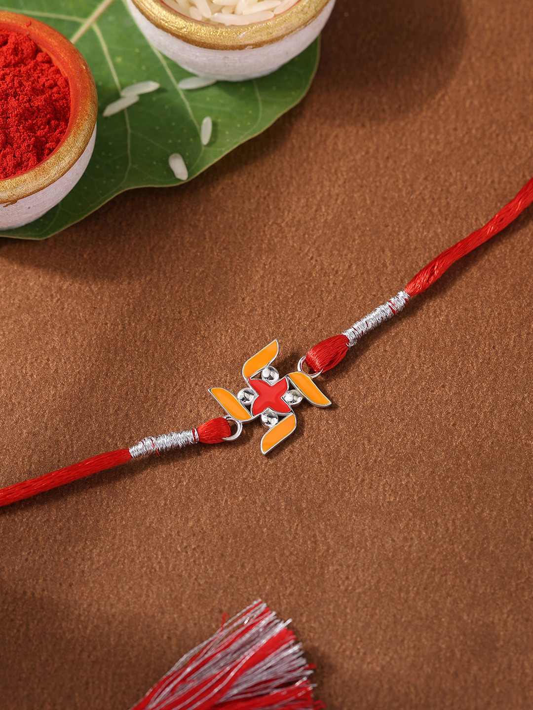 Ornate Jewels 925 Silver Religious Designer Red Enamel Swastik Rakhi With Roli Chawal