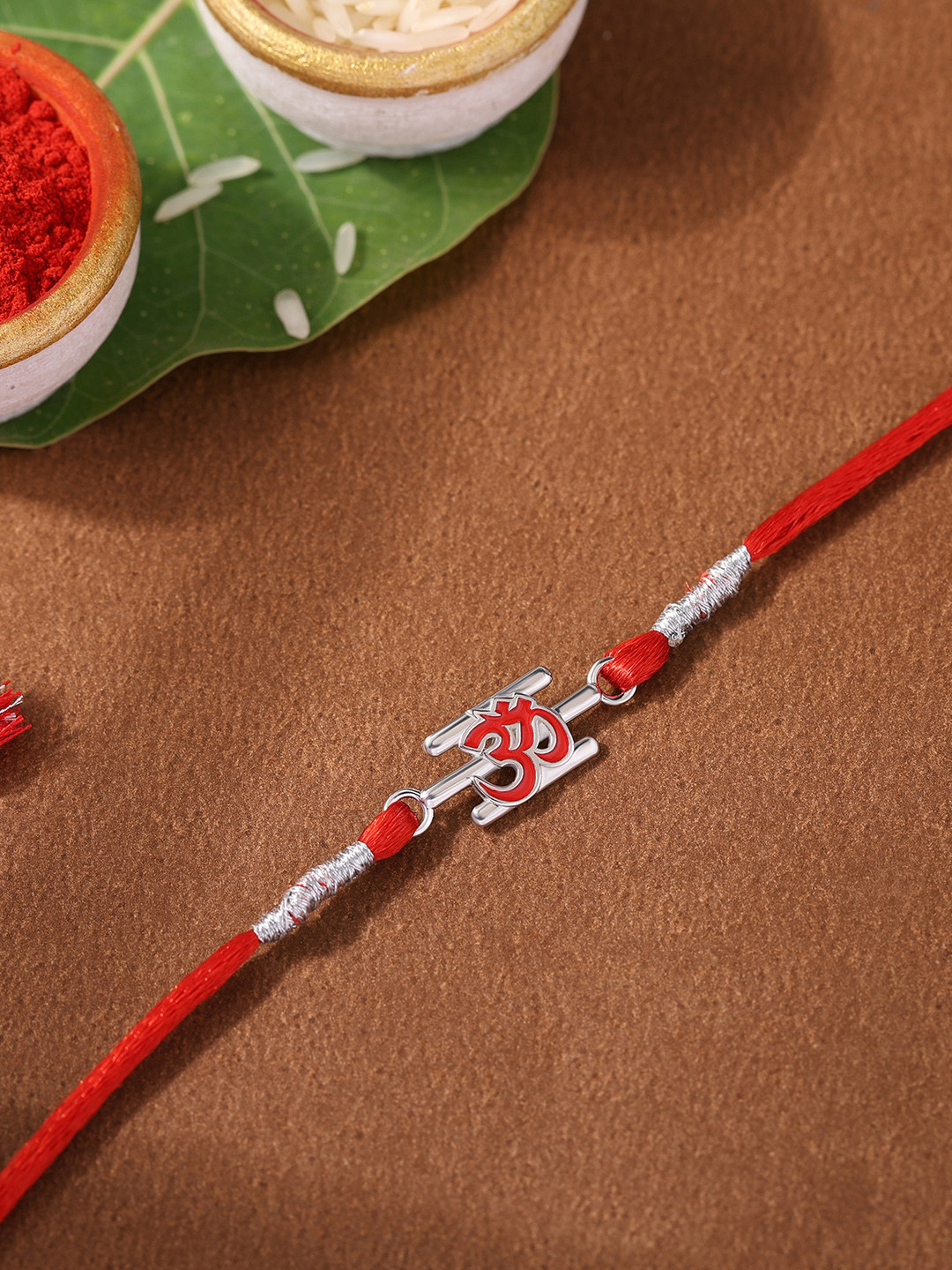 Ornate Jewels 925 Silver Religious Designer Red Enamel Swastik Rakhi With Roli Chawal