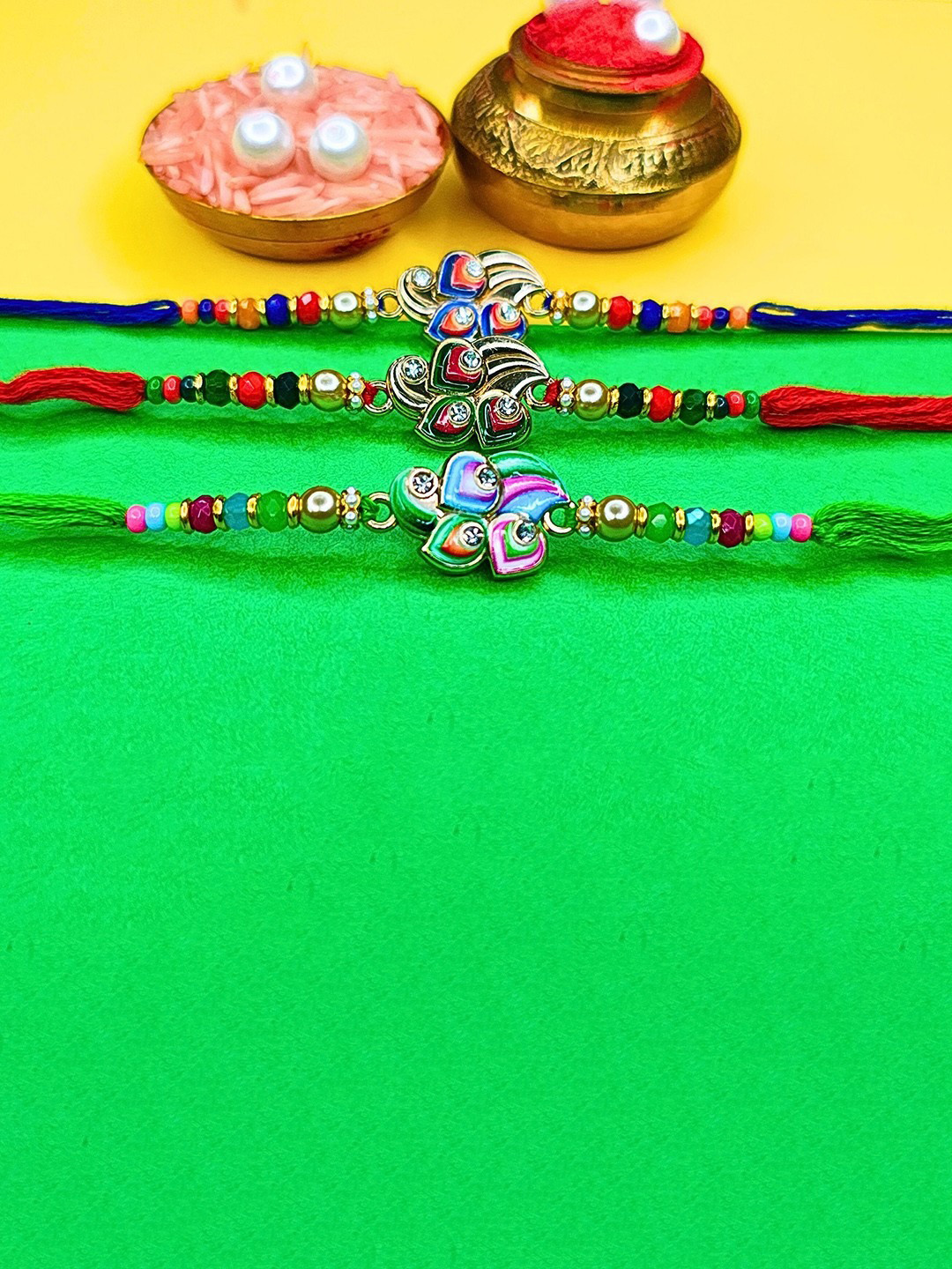 ORANGENYSHA Set Of 3 Beaded Cotton Thread Rakhis With Rholi Chawal