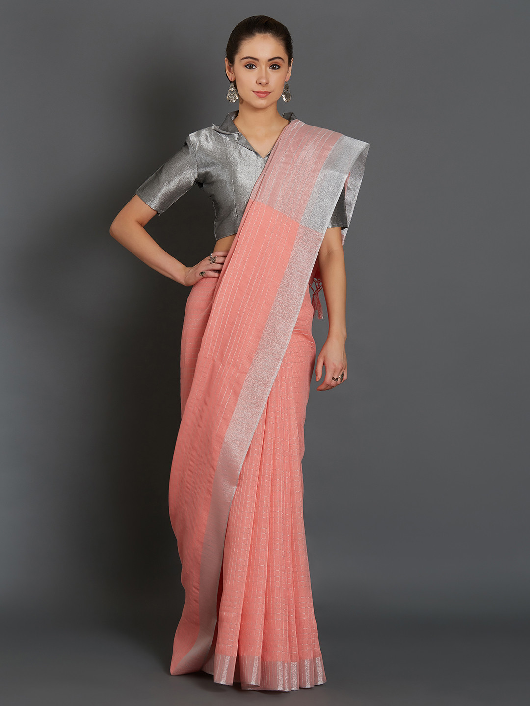 peach color saree with silver blouse