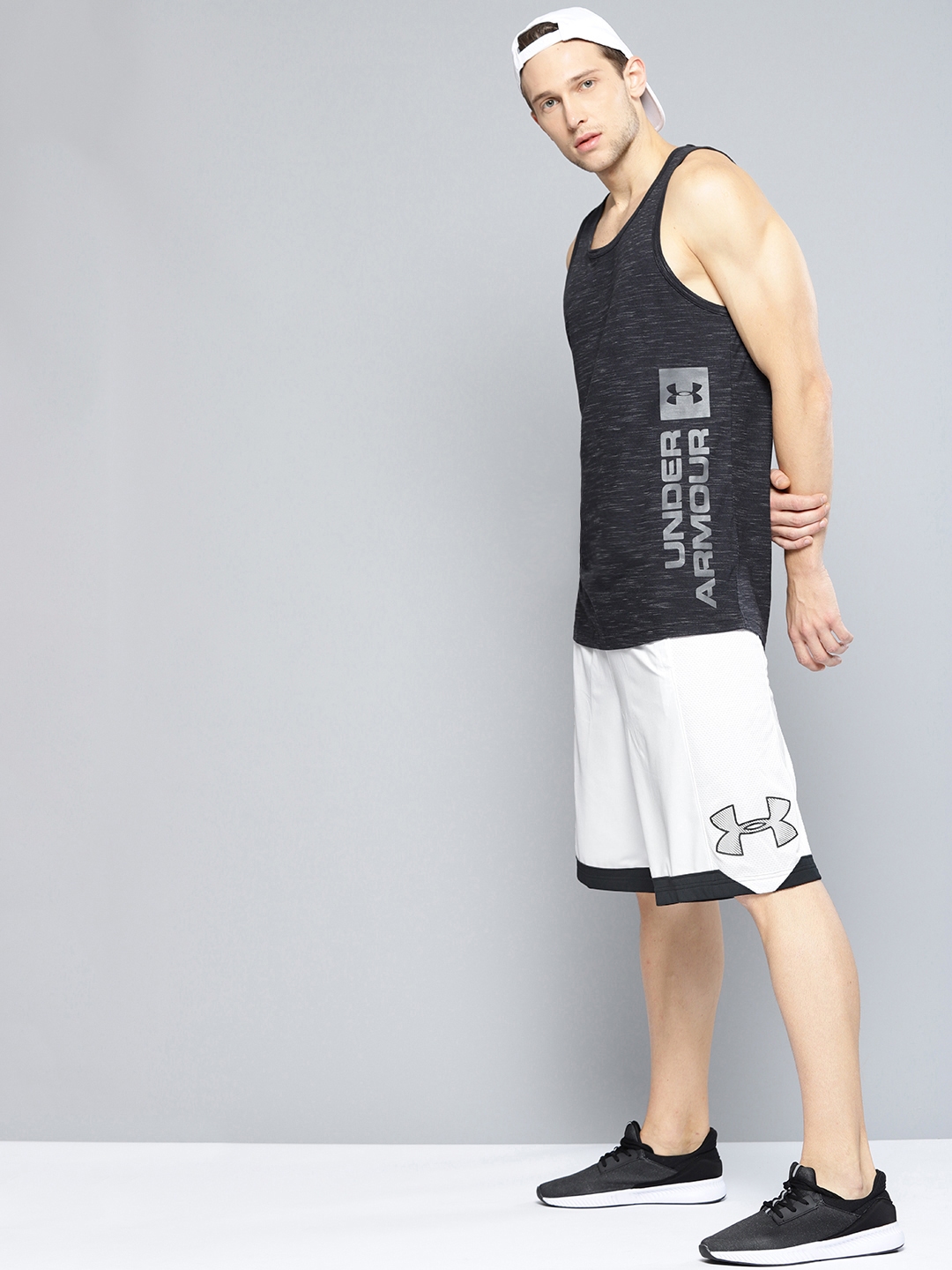 Buy UNDER ARMOUR Men White Isolation 11in Solid Basketball Shorts