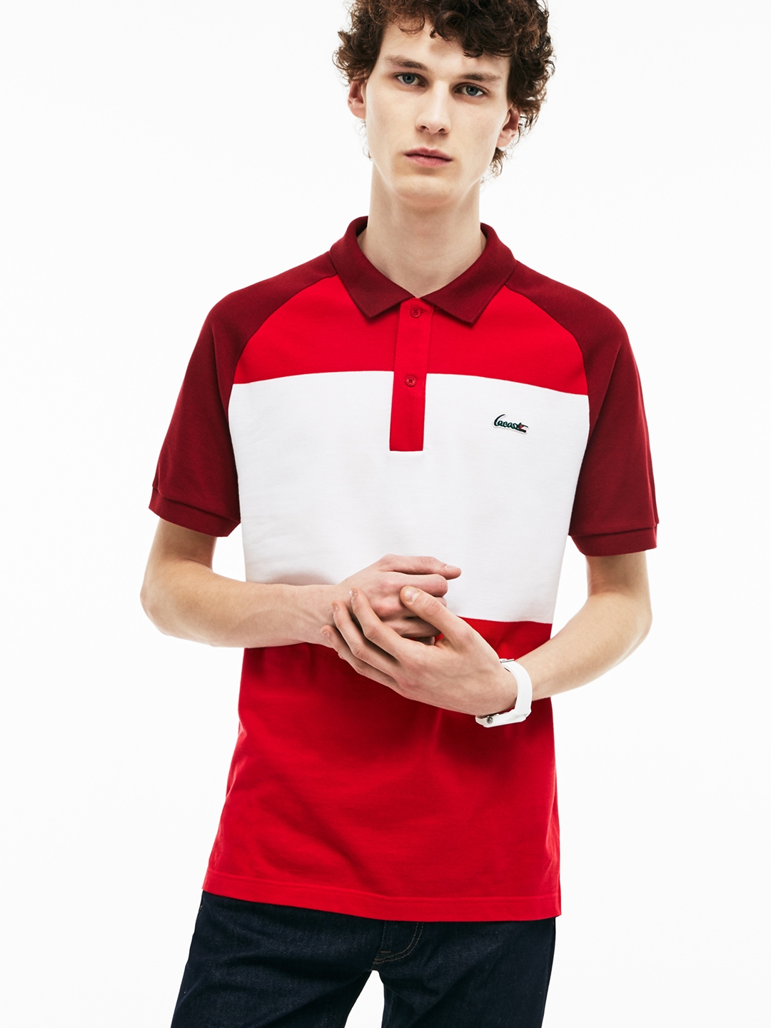 white and red lacoste shirt