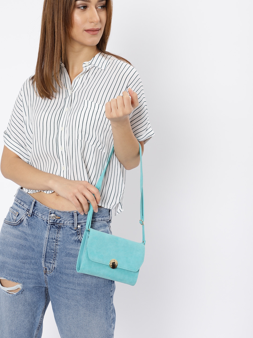 caprese blue solid sling bag