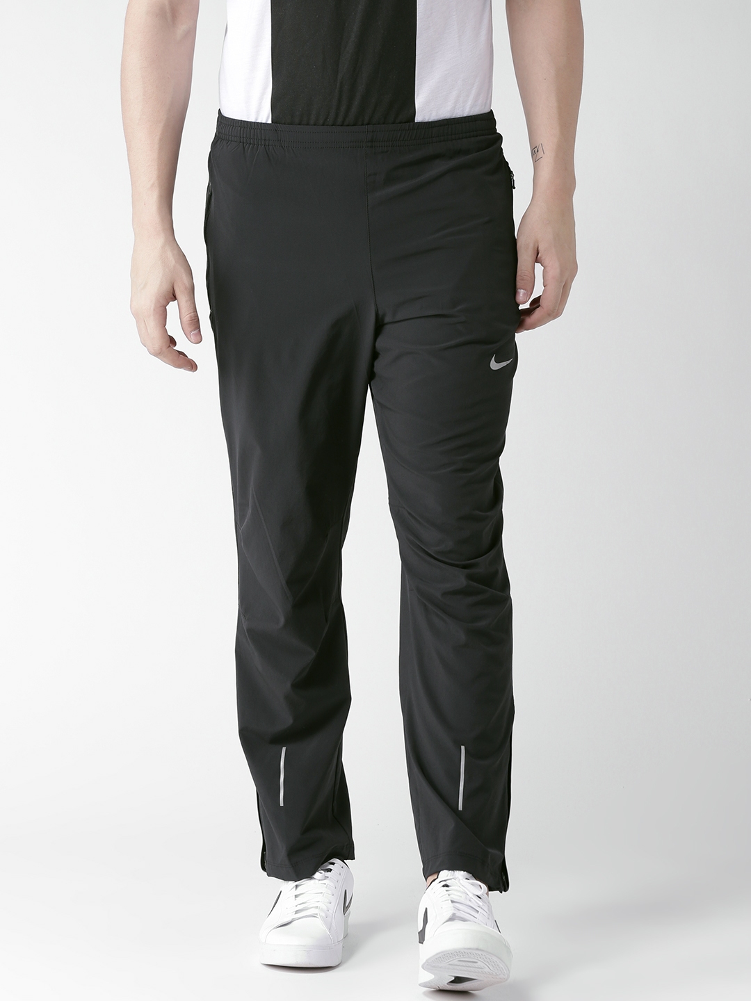 Nike Running Swoosh track pants in black  ASOS