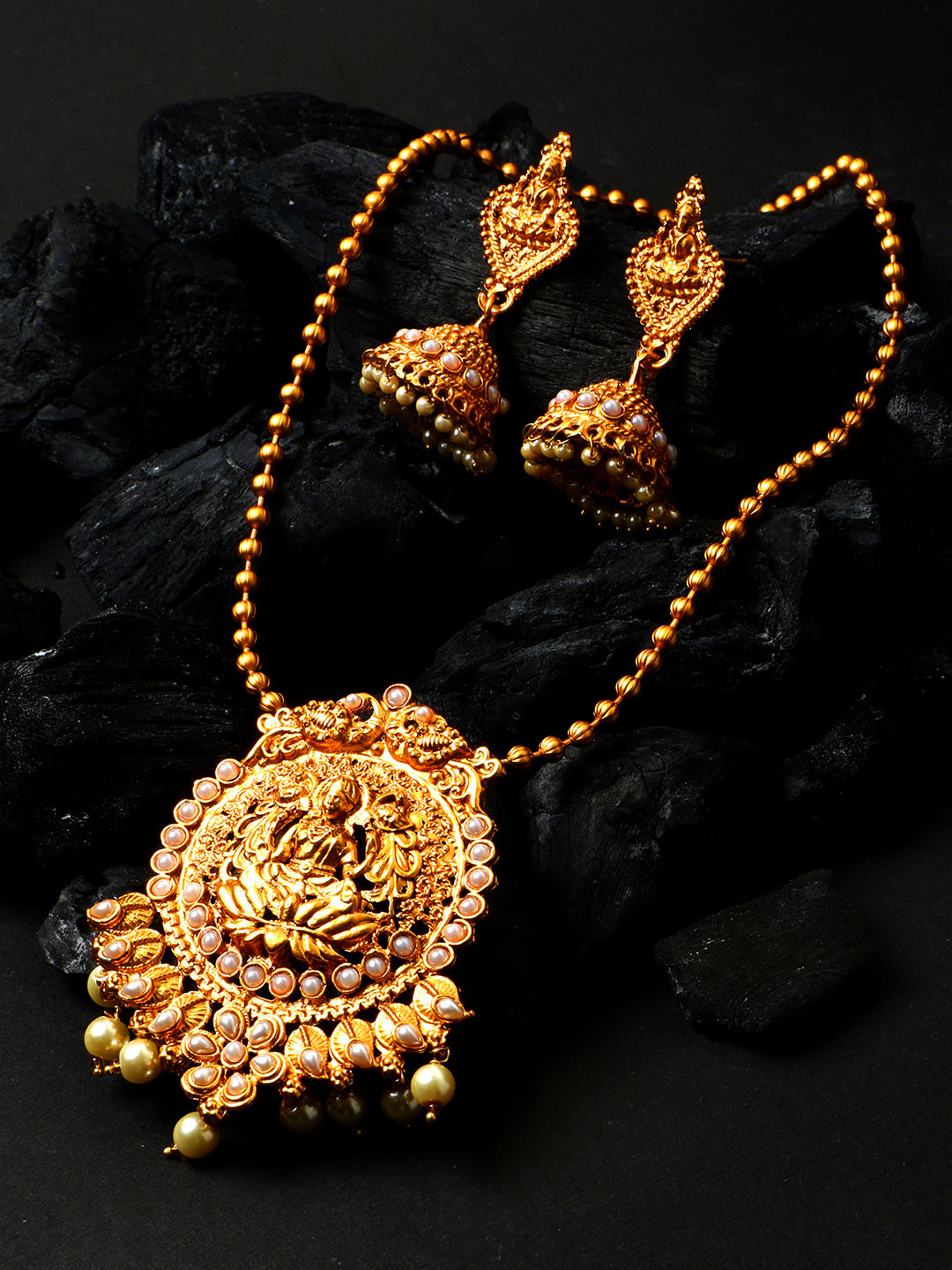 ANIKAS CREATION Women Gold-Plated Goddess Laxmi White Stone-Studded Temple Jewellery Set