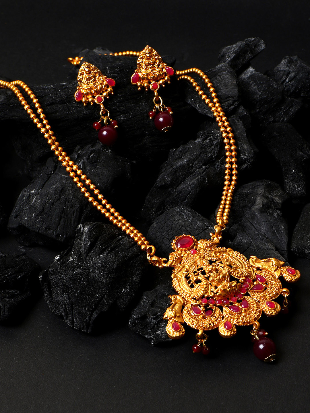 ANIKAS CREATION Women Antique Matte Gold Finish & Maroon Stone-Studded Temple Jewellery Set