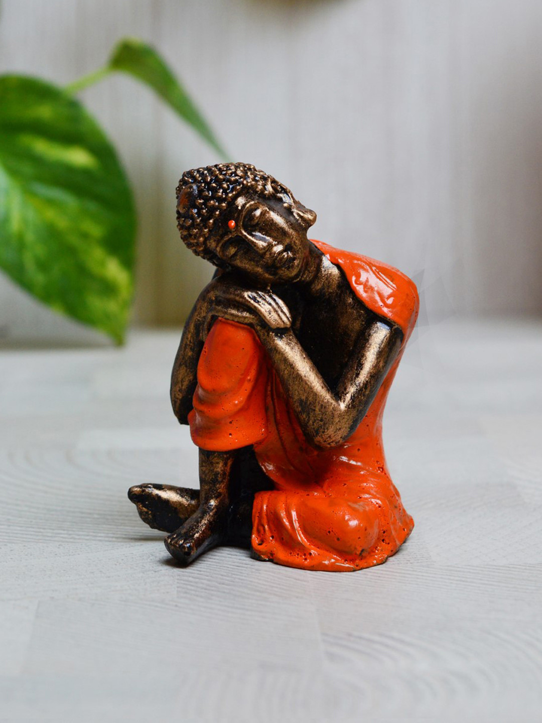 eCraftIndia Resting Buddha on Knee Orange Polyresin Glossy Prayer Room Tiny Showpiece - 3 Inches