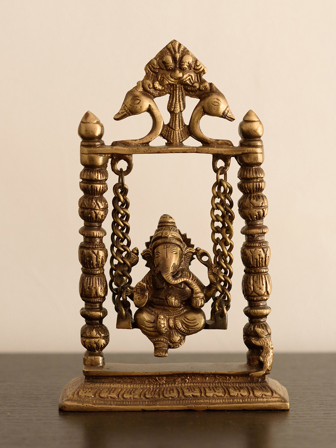 eCraftIndia Lord Ganesha on Jhoola Gold Brass Metallic Prayer Room Medium Showpiece - 11 Inches
