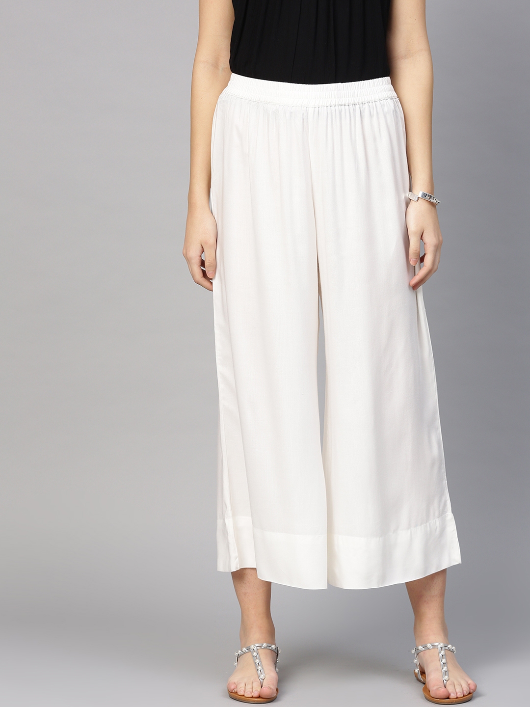 Off white palazzo pants online hot sale