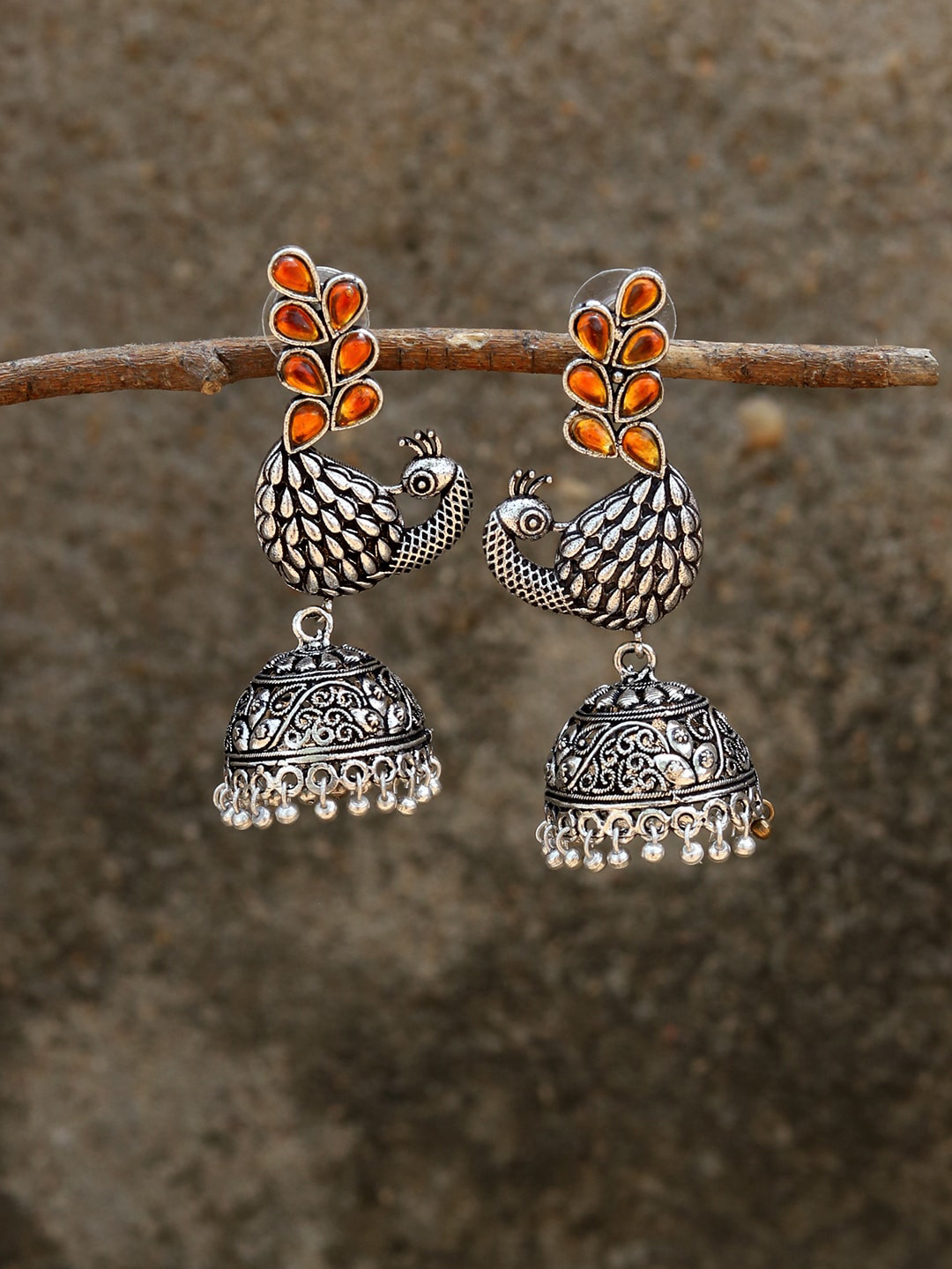 Silvermerc Designs Silver-Plated Orange Oxidised Peacock Shaped Jhumkas