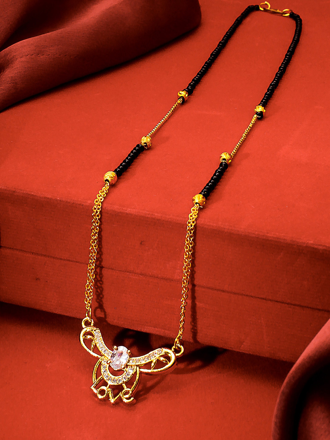 aadita Gold-Plated Black & White American Diamond Studded & Beaded Mangalsutra