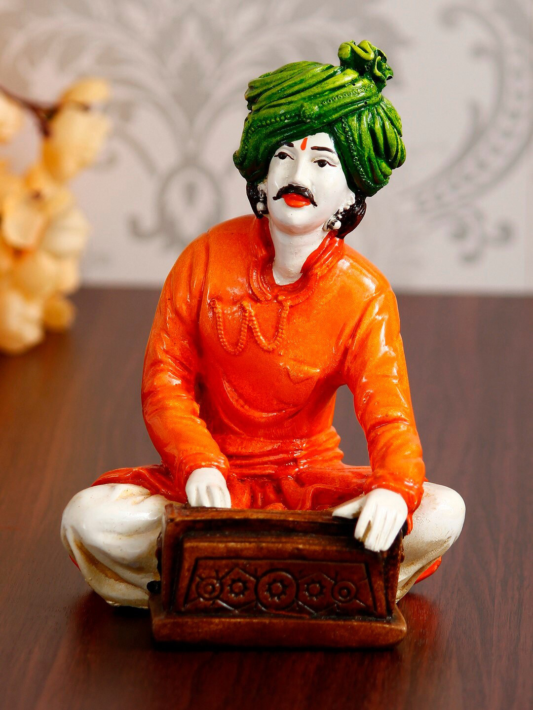 eCraftIndia Rajasthani Musician Playing Harmonium Orange Polyresin Glossy Living Room Hand-Crafted Small Showpiece - 7.5 Inches