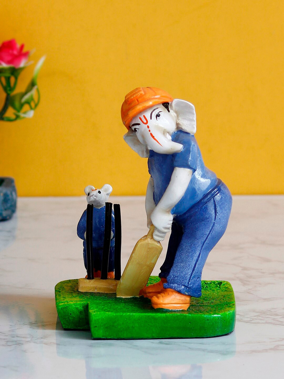 eCraftIndia Lord Ganesha Playing Cricket with Mushak Orange Polyresin Glossy Living Room Hand-Crafted Medium Showpiece - 5.7 Inches