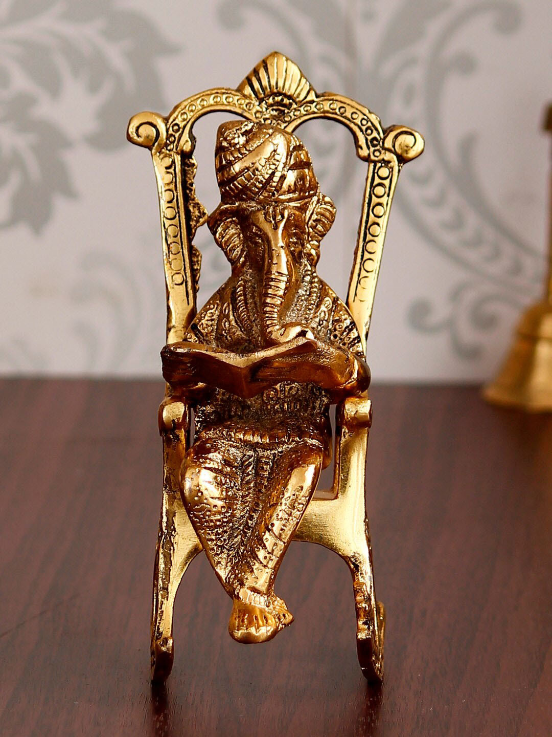 eCraftIndia Lord Ganesha on Rocking Chair Gold Metal Metallic Prayer Room Small Showpiece - 6.7 Inches
