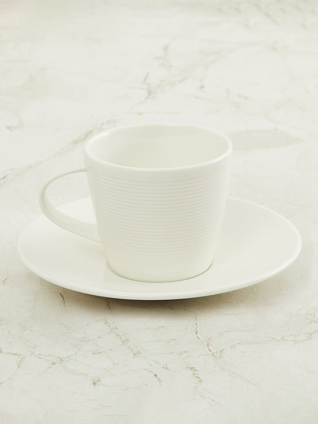 Home Centre White Marshmallow Textured Porcelain Cup And Saucer