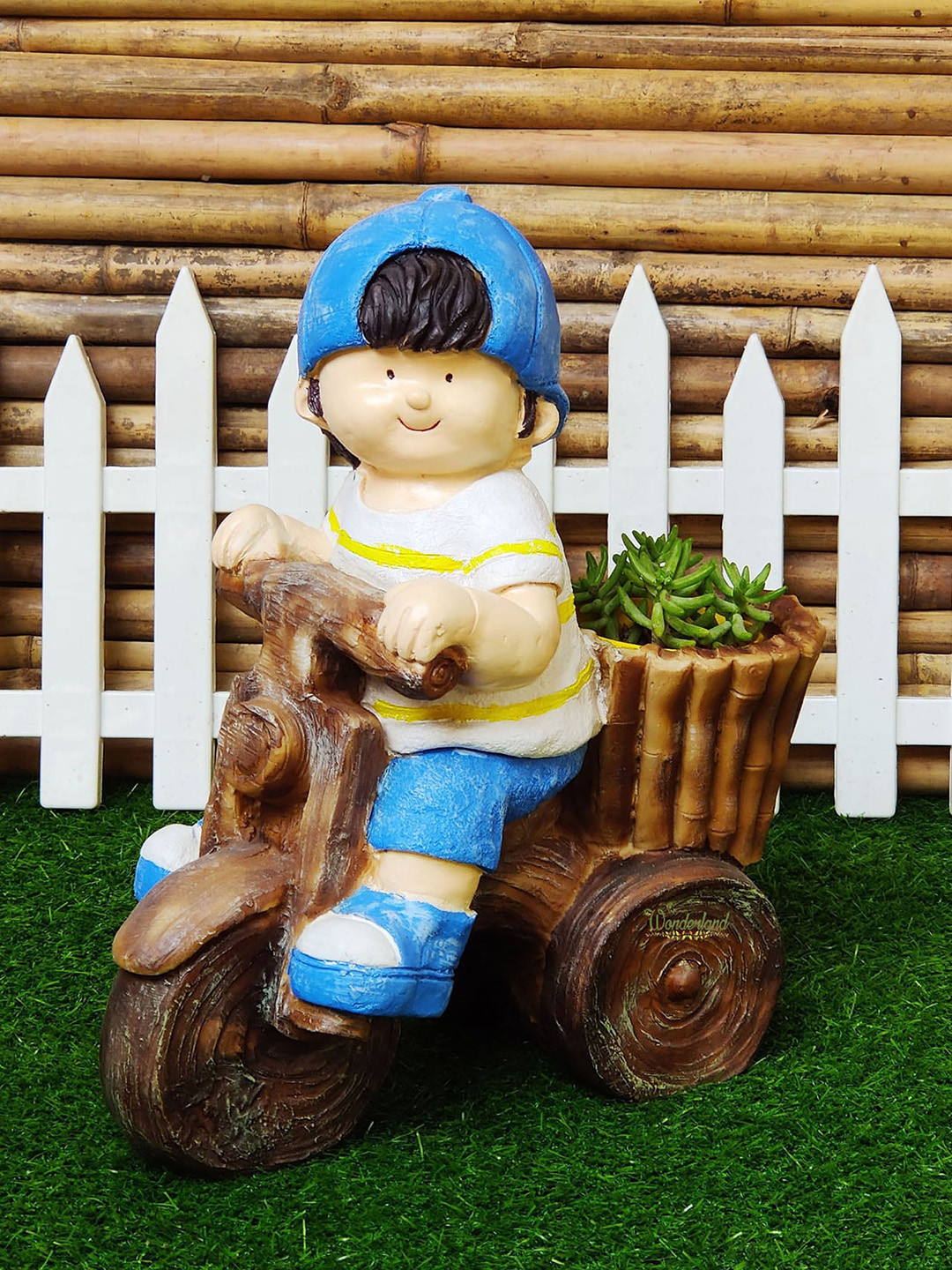 Wonderland Blue Boy On Cycle In Planter