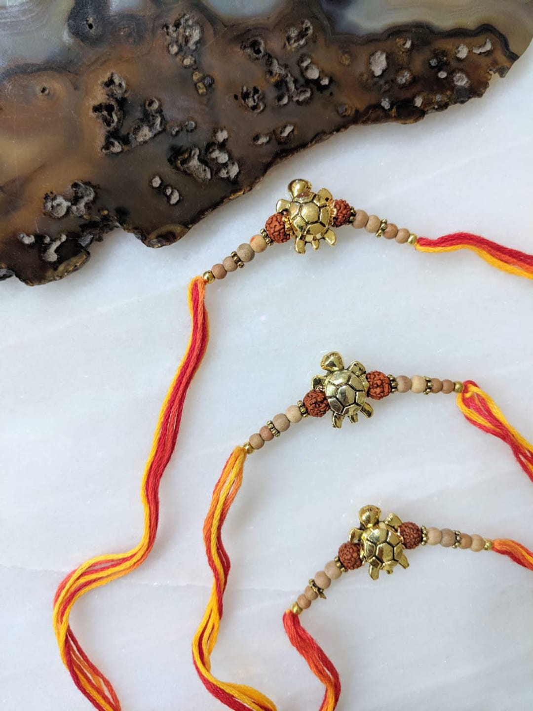Digital Dress Room Red & Yellow Rakhi With Tortoise Pendant & Rudhraksha Tulsi Beads