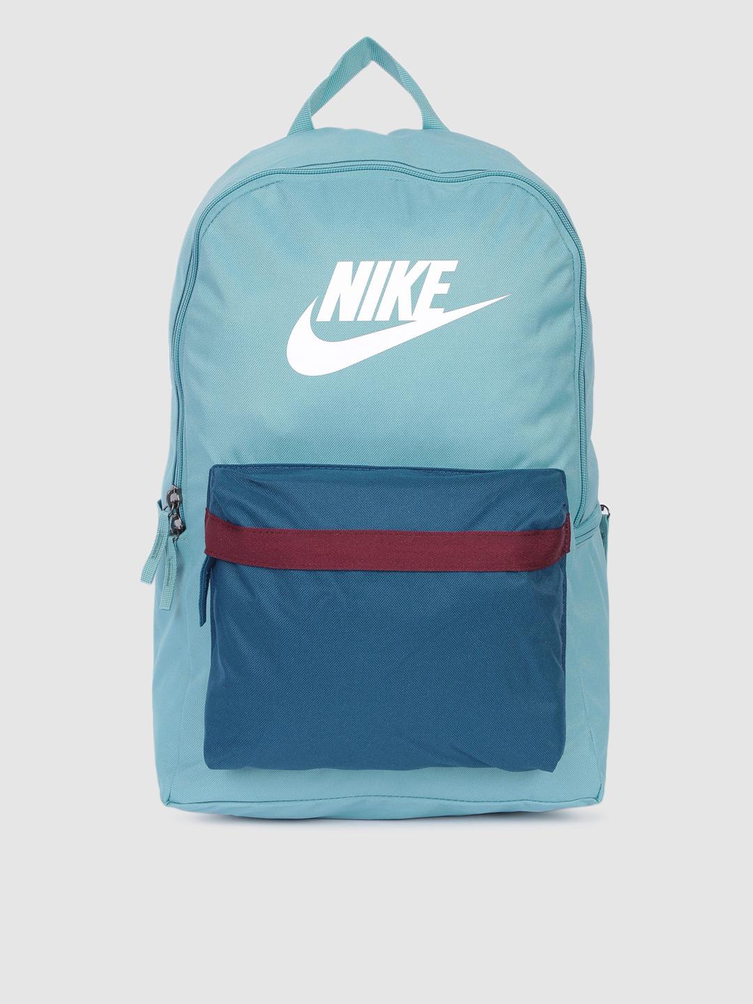 nike blue brand logo backpack 3 Blitz  Navy  30L | Padded 15 in sleeve, mesh organizer, side bottle pocket, 2 zip pockets. For boys, girls, men, women, gym, and travel quality materials to withstand daily wear and tear. Nike Brasilia Medium Backpack 