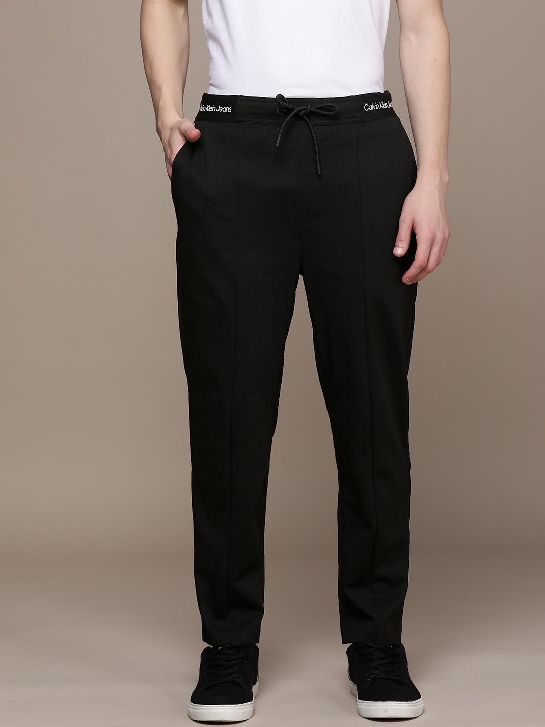 Buy Calvin Klein Jeans Men Black Solid Regular Track Pants With