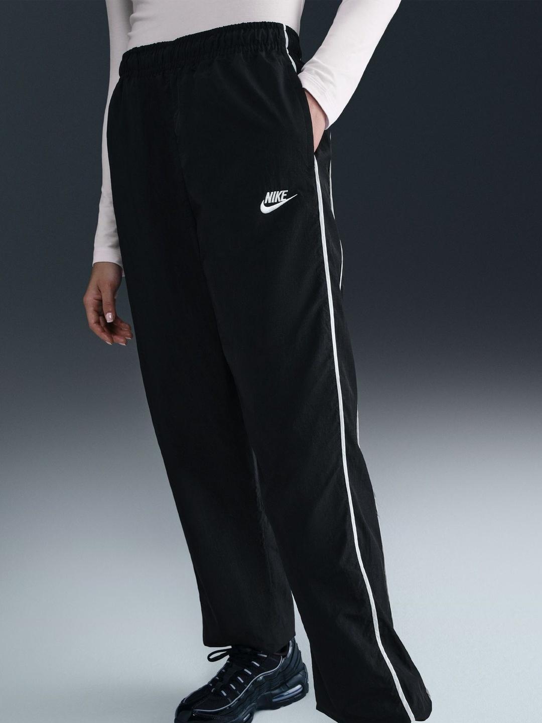 nike black track pants with white stripe