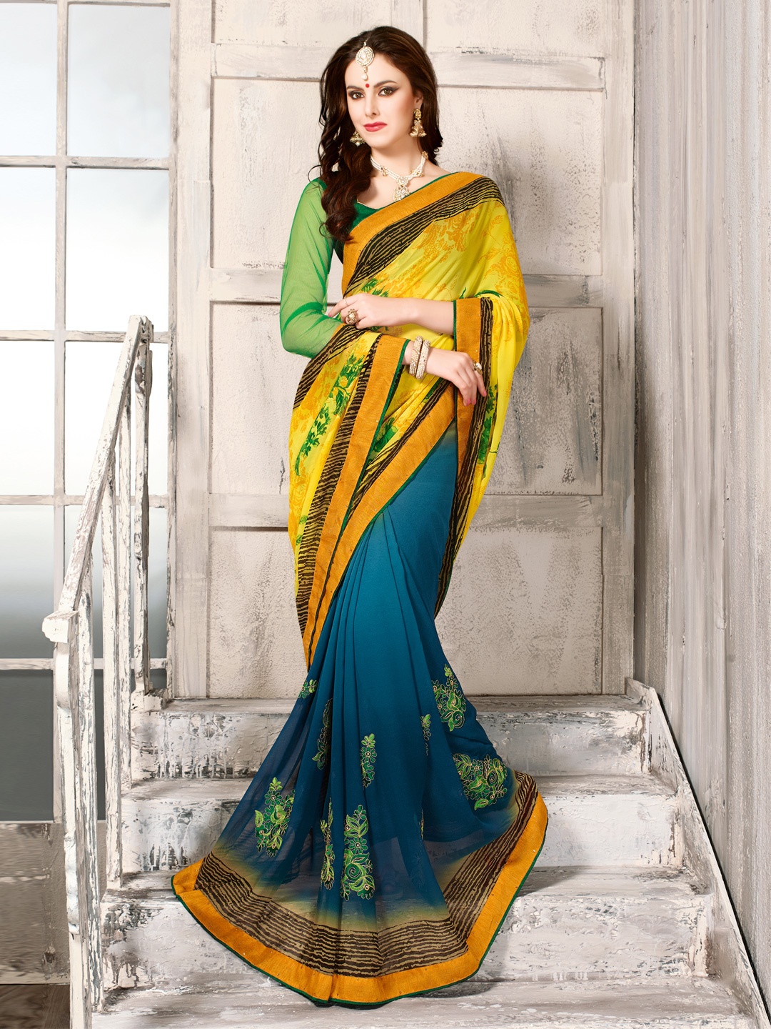 

Kalista Yellow & Blue Printed Chiffon Embellished Saree