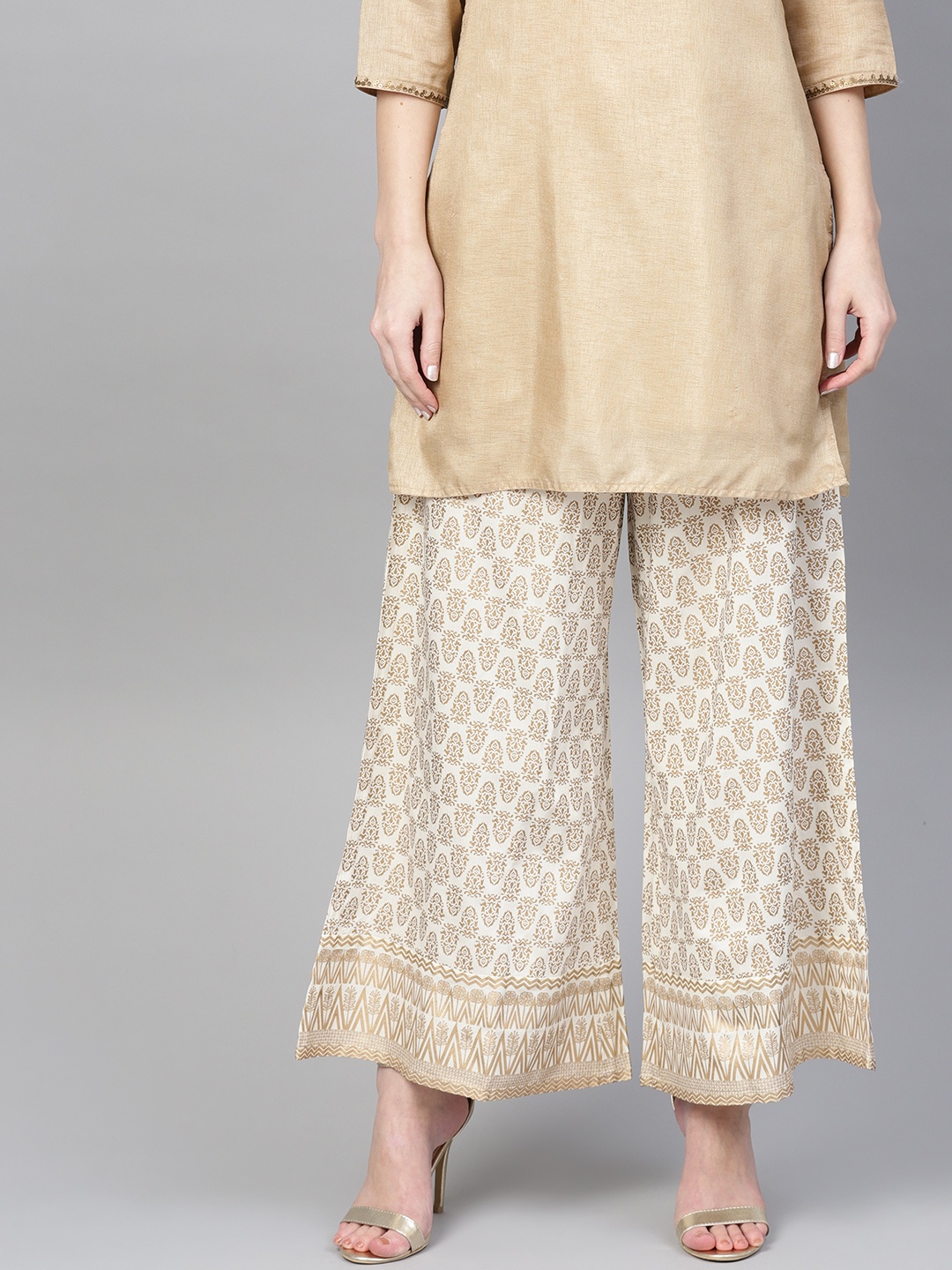 

Varanga Women Off-White & Golden Printed Wide Leg Palazzos