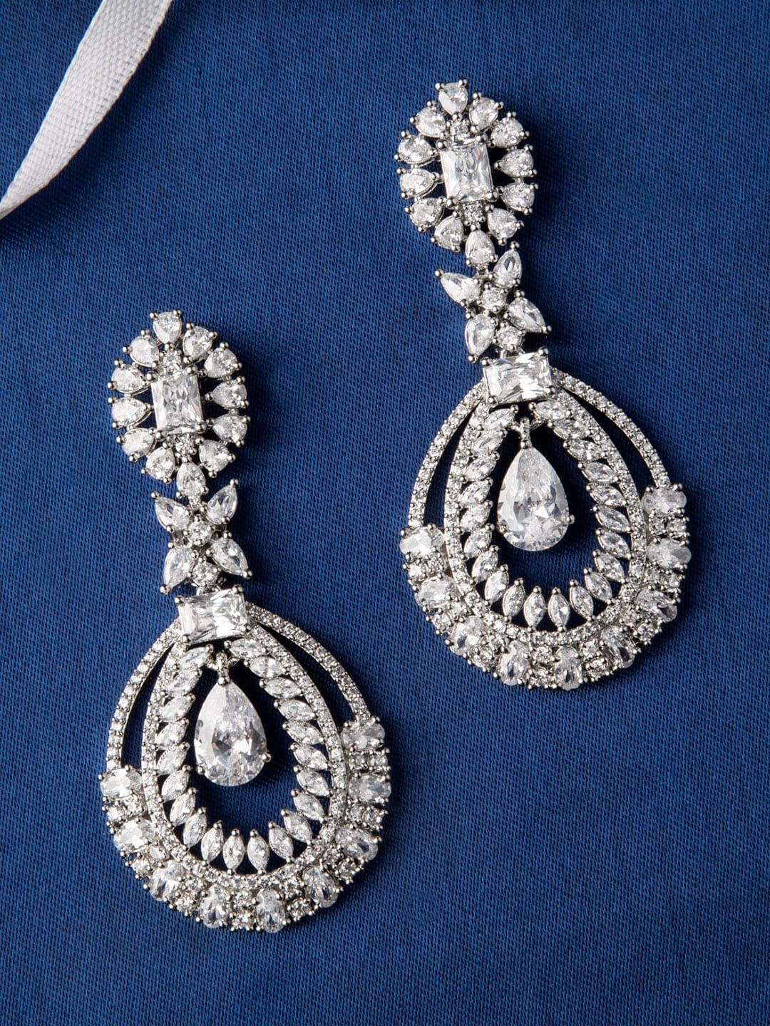 

Rubans Silver-Toned & White Handcrafted Oval Drop Earrings