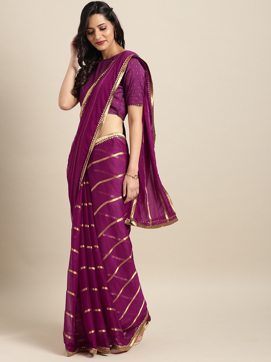 

Inddus Purple & Gold-Coloured Poly Chiffon Striped Saree