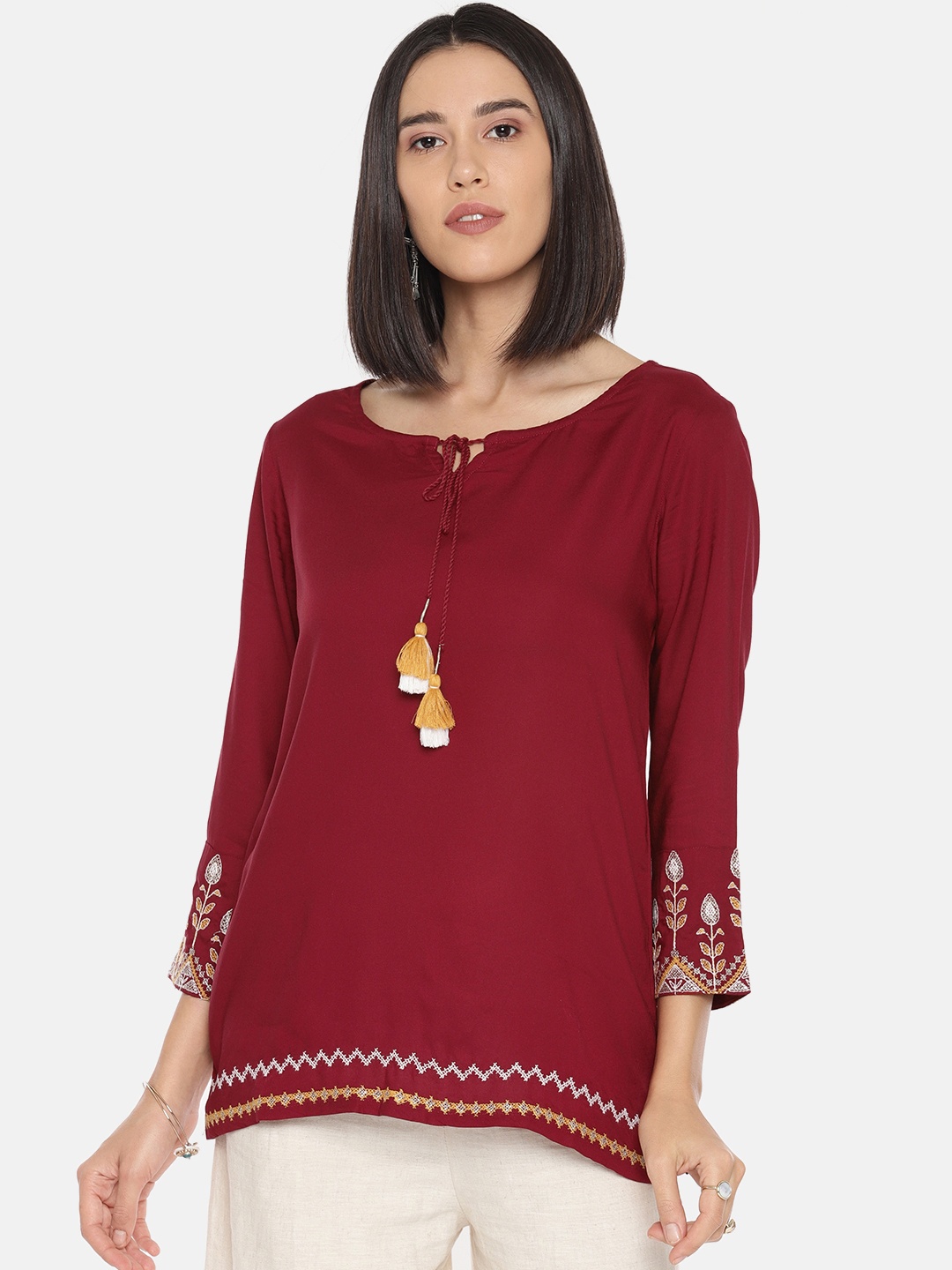 

Global Desi Women Maroon Solid Top