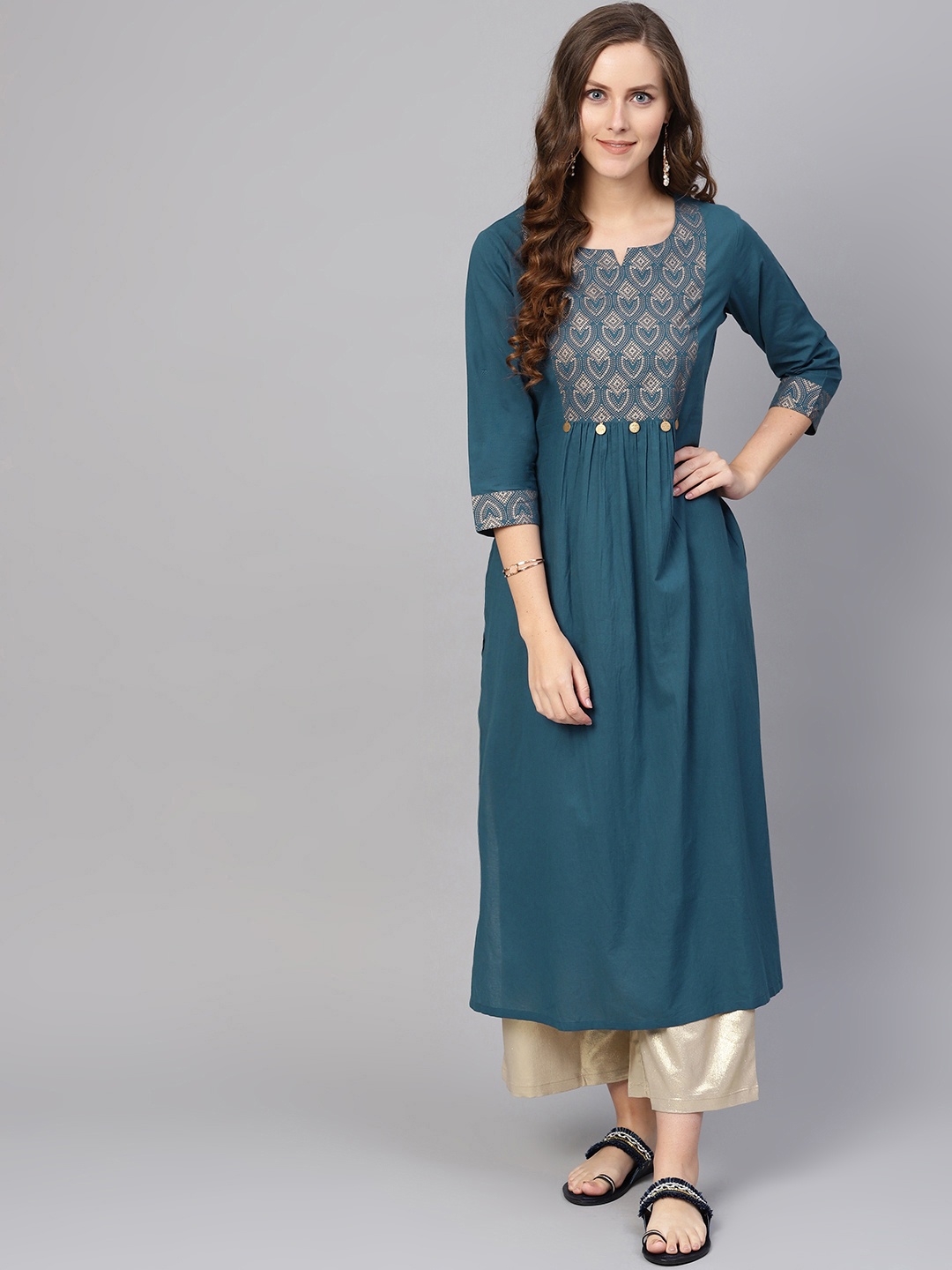 

Varanga Women Teal Blue & Golden Yoke Design A-Line Kurta