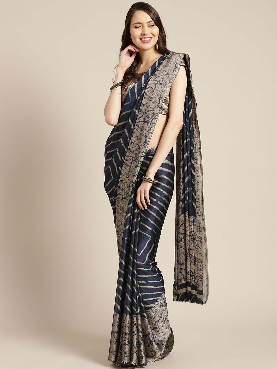 

Tikhi Imli Navy Blue & Beige Striped Saree