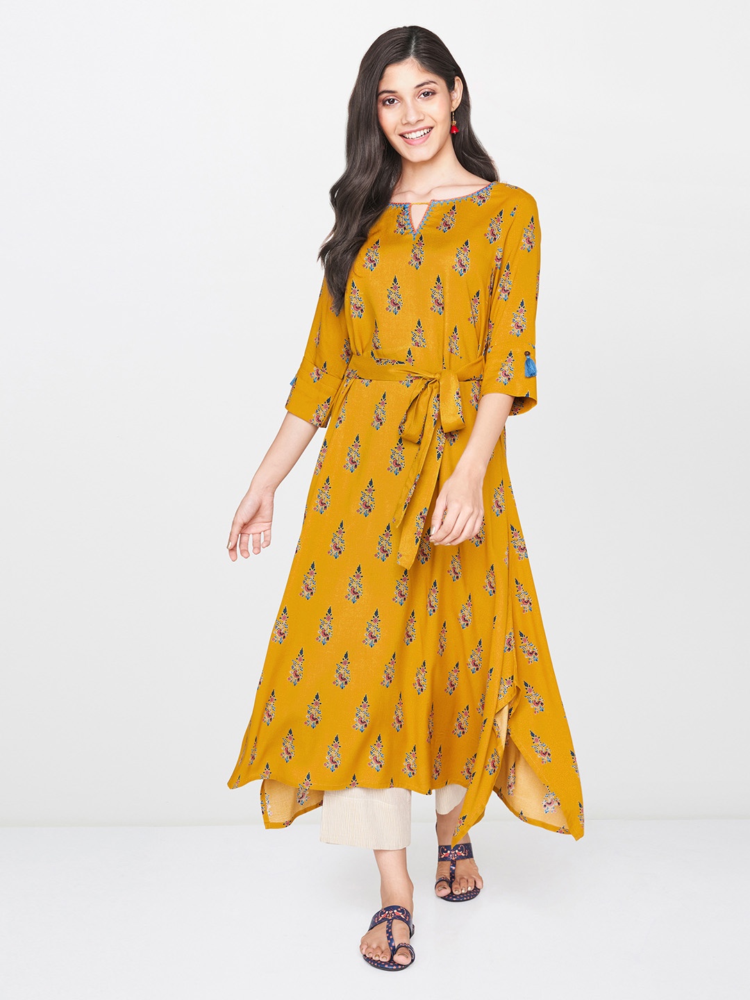 

Global Desi Women Mustard Yellow & Teal Blue Printed Asymmetric A-Line Kurta