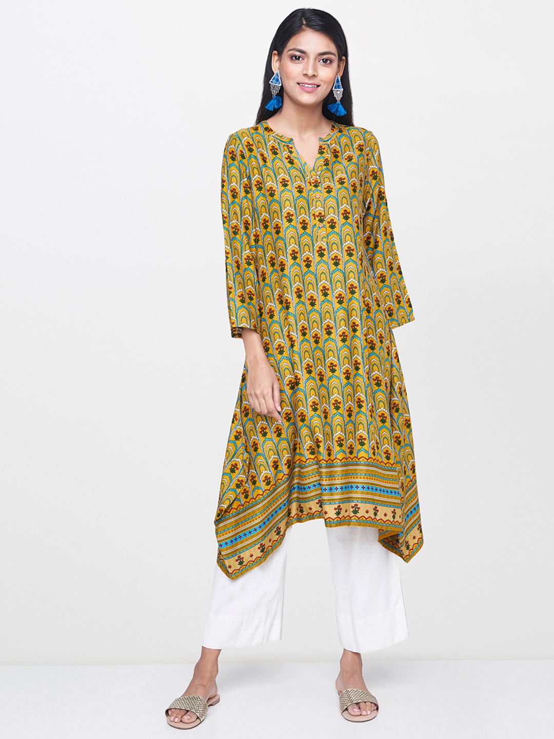 

Global Desi Women Mustard Yellow & Turquoise Blue Printed Tunic