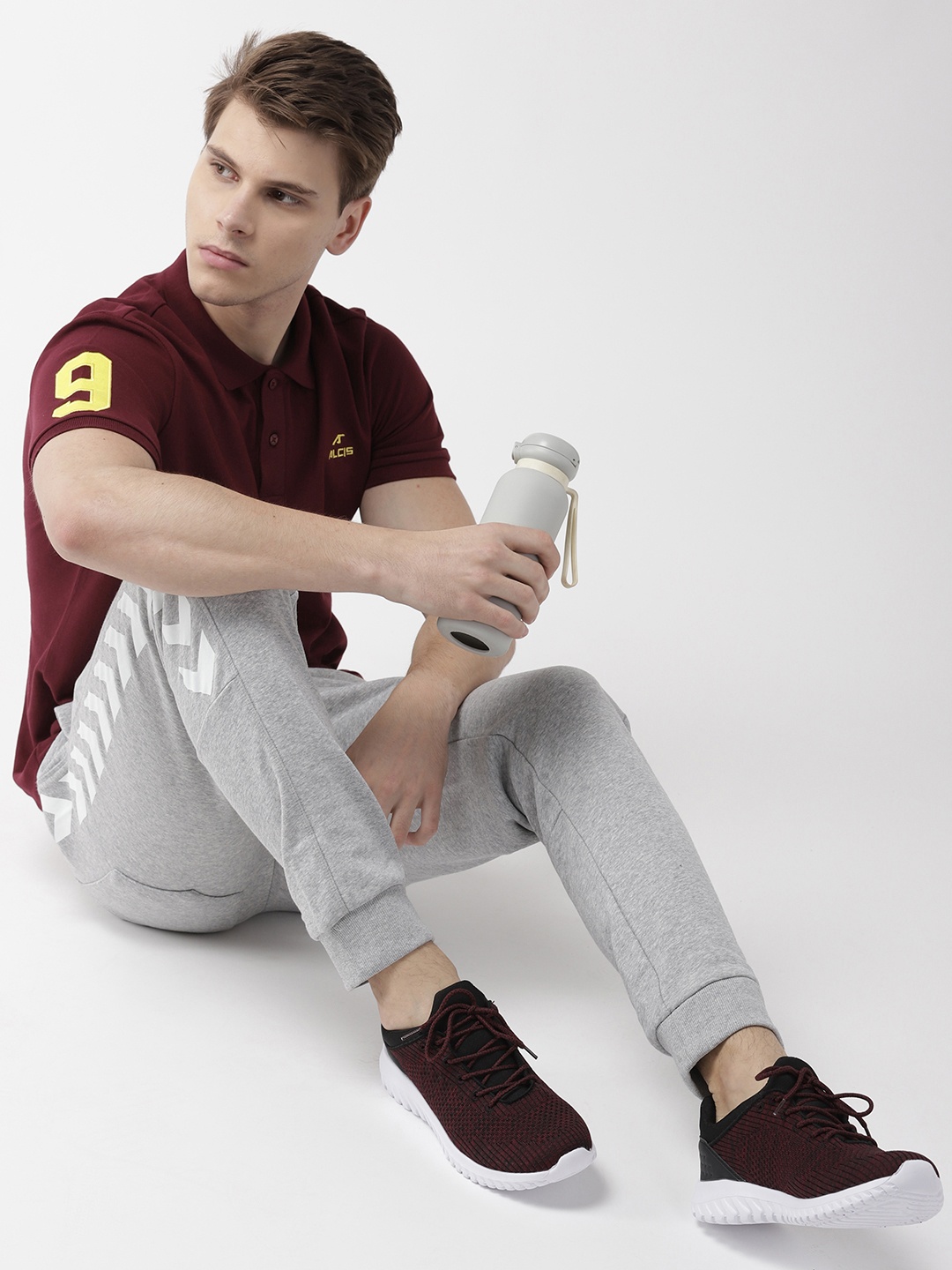 

Alcis Men Burgundy Solid Polo Collar T-shirt