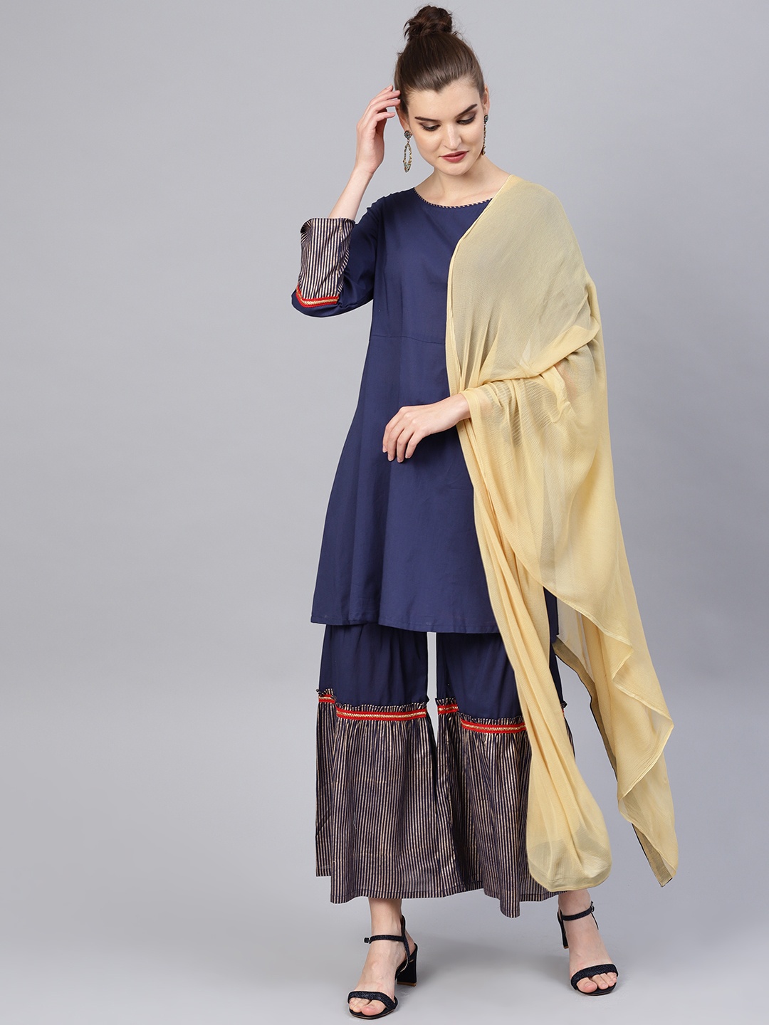 

Tulsattva Women Navy Blue & Golden Solid Kurta with Sharara & Dupatta