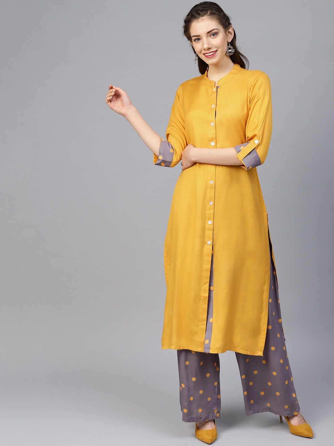 

Jompers Women Mustard Yellow & Grey Solid Kurta with Palazzos