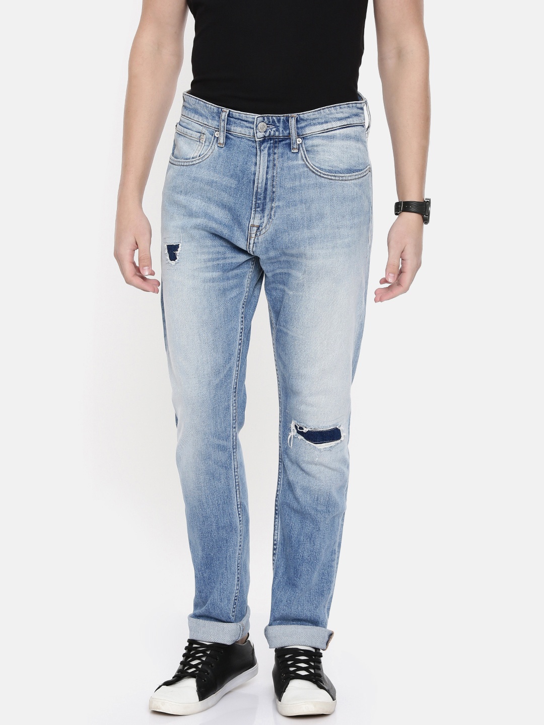 

Calvin Klein Jeans Men Blue Athletic Tapered Fit Mid-Rise Mildly Distressed Jeans 056