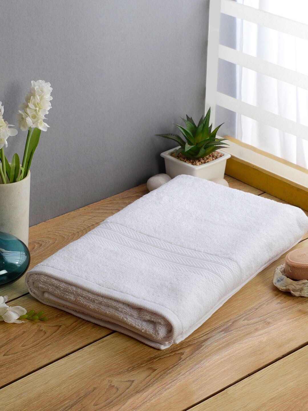 

Softweave Men White Self Design 525 GSM Bath Towel