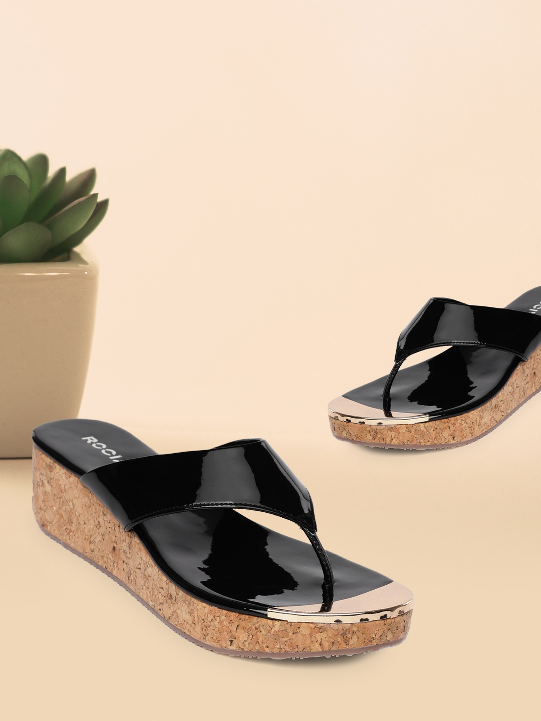 

Rocia Women Black Solid Wedges