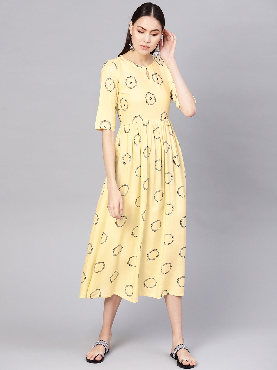 

Gerua By Libas Women Yellow Black Printed Midi A-Line Dress